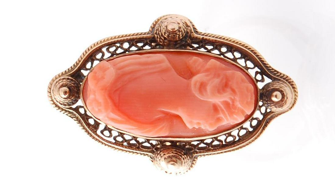 A 9ct gold and precious coral ring. The ring set with a (1 of 4)