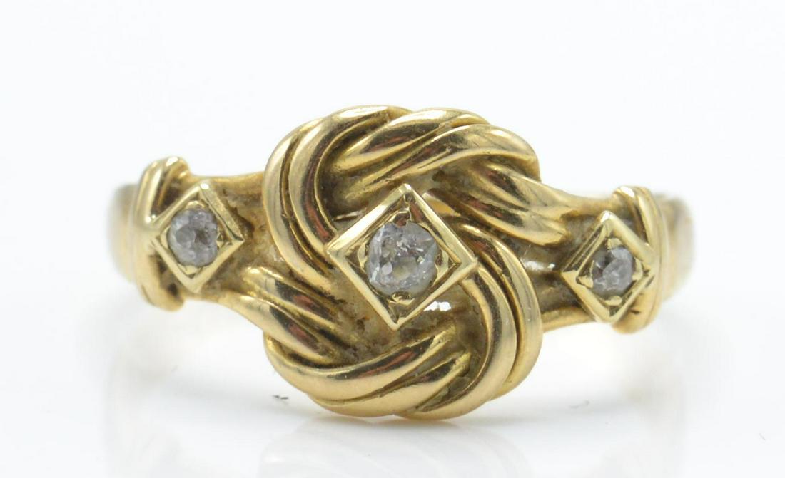 A hallmarked 18ct gold and diamond knot ring. The ring (1 of 4)