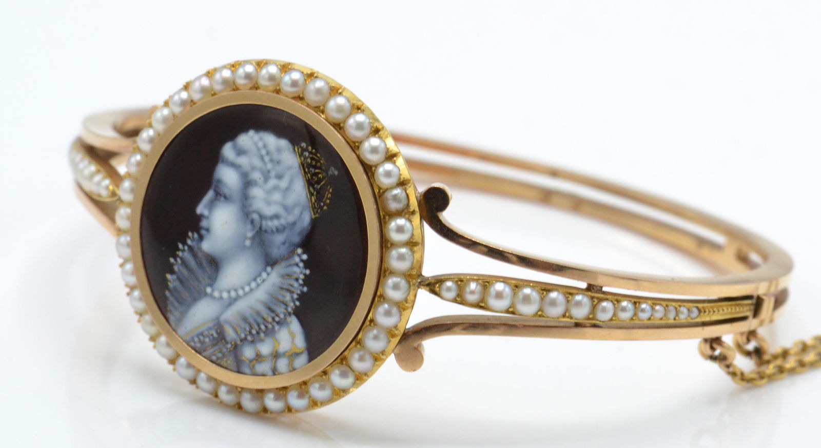 An antique gold and seed pearl hinged bracelet /  (1 of 5)