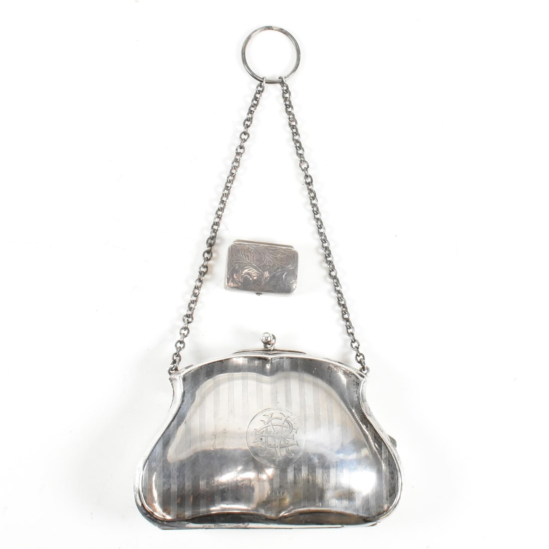 EARLY 20TH CENTURY PURSE & 1980S PILL BOX: An early 20th century hallmarked silver purse and 1980s pill box. The purse hallmarked Birmingham 1918. Makers Mark H.W.Ld. Henry Williamson Ltd. Pill box hallmarked London 1987 Sponsor mark AN for&nb