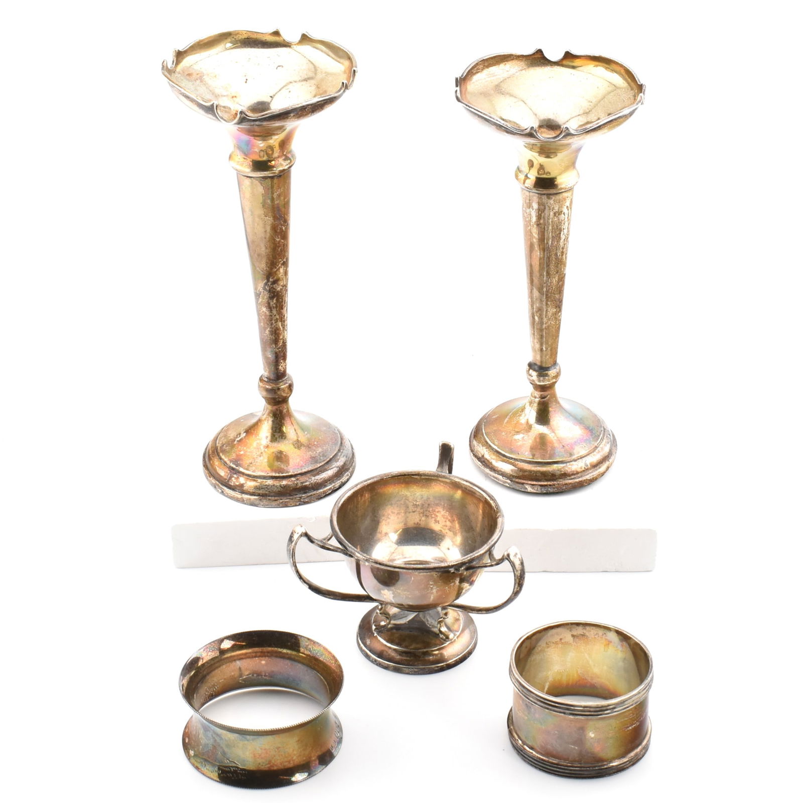 COLLECTION OF EARLY 20TH CENTURY HALLMARKED SILVER: A collection of hallmarked silver items. The lot to include a pair of George V weighted posy vases. Hallmarked for Birmingham 1919. Makers mark for Philip Hanson Abbot. Two silver napkin rings wi