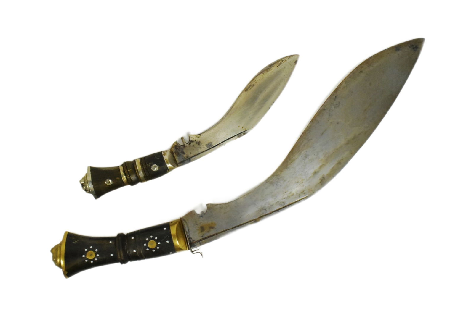 TWO VINTAGE KUKRI KNIVES: Two vintage Nepalese / Gurkha style kukri knife daggers. Typical form with bone and horn hilts inlaid with brass rivets and white metal collars and curved blades. Largest measures approx 40cm. If thi