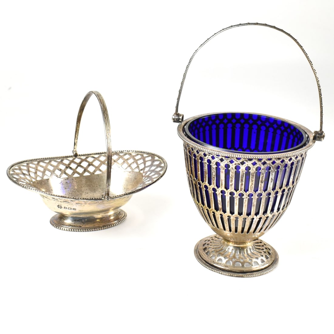 GEORGE V HALLMARKED SILVER BON BON DISH T/W ANOTHER HALLMARKED BON BON DISH TBC: A Georve V hallmarked silver blue glass lined bob bon dish. Hallmarked Birmingham 1929, sponsors mark for Barker Brothers Silver Ltd. Weight (exc liner) 96g. Together with a hallmarkes silver lozenge