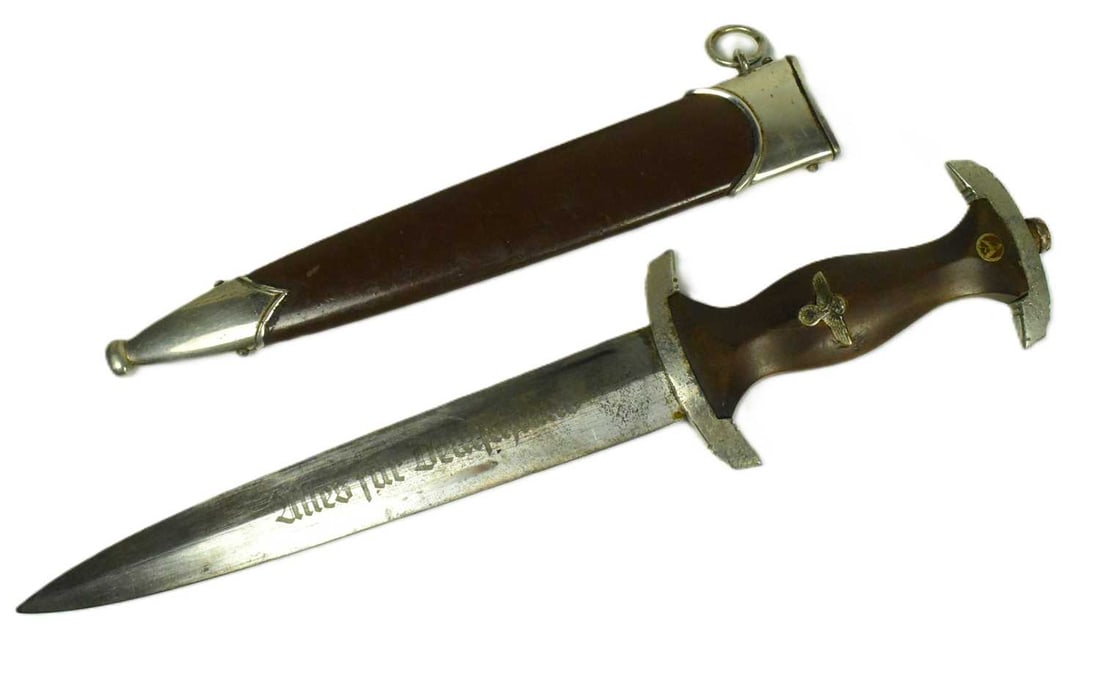 WWII SECOND WORLD WAR GERMAN THIRD REICH SA DAGGER: A WWII Second World War Third Reich Nazi German SA Officers dress dagger. The dagger having a shaped wooden grip with inset SA roundel and Eagle Swastika shape badge to the grip. The ricasso marked RZ