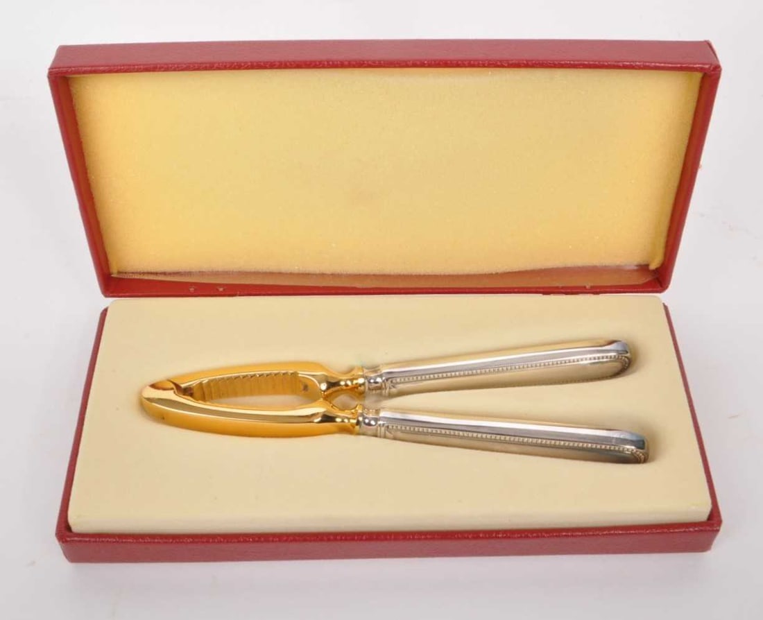 ROBBE & BERKING - 20TH CENTURY GOLD AND SILVER PLATE NUT CRACKER: Robbe & Berking - Late 20th century gold and silver plate nut cracker in original box. Measures approx. 16cm long