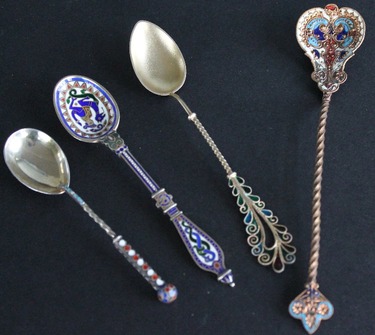 Antique Souvenir Spoon Collection Sterling, Champleve: Eclectic collection of four souvenir spoons. One Aztec style spoon marked on underside, Chicago, Nov 11, 1891. A marked sterling spoon with plique a jour decorative accent on handle. Ornate French cha