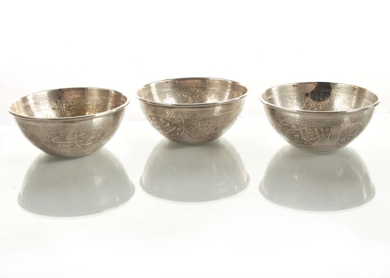 Fine Set of Three Egyptian .900 Silver Bowls Arabic: Lovely set of three hallmarked Egyptian silver bowls with very detailed Arabic / Middle Eastern decoration throughout. Circa 1940s. 4.5in diameter.