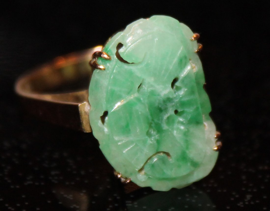Chinese 14K YG Green & White Carved Jadeite Ring: Carved apple green and white jadeite butterfly stone in a finely detailed 14K yellow gold mounting. Marked 14K on the inside of band. Size 6. Weight: 2.5g. Stone measures 1/2in x 5/8in.