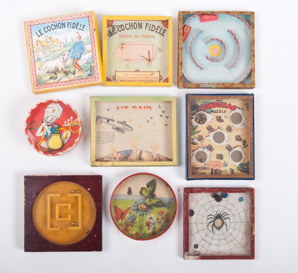 Patience games: Ca. 1920-30. Hille's Koffie- Ameropa. Wooden frame with map of the world on which metal balls need to be wobbled in place + Pootles the Pup, Give him a Bone +made by R. Journet, London + Spinnewebspel