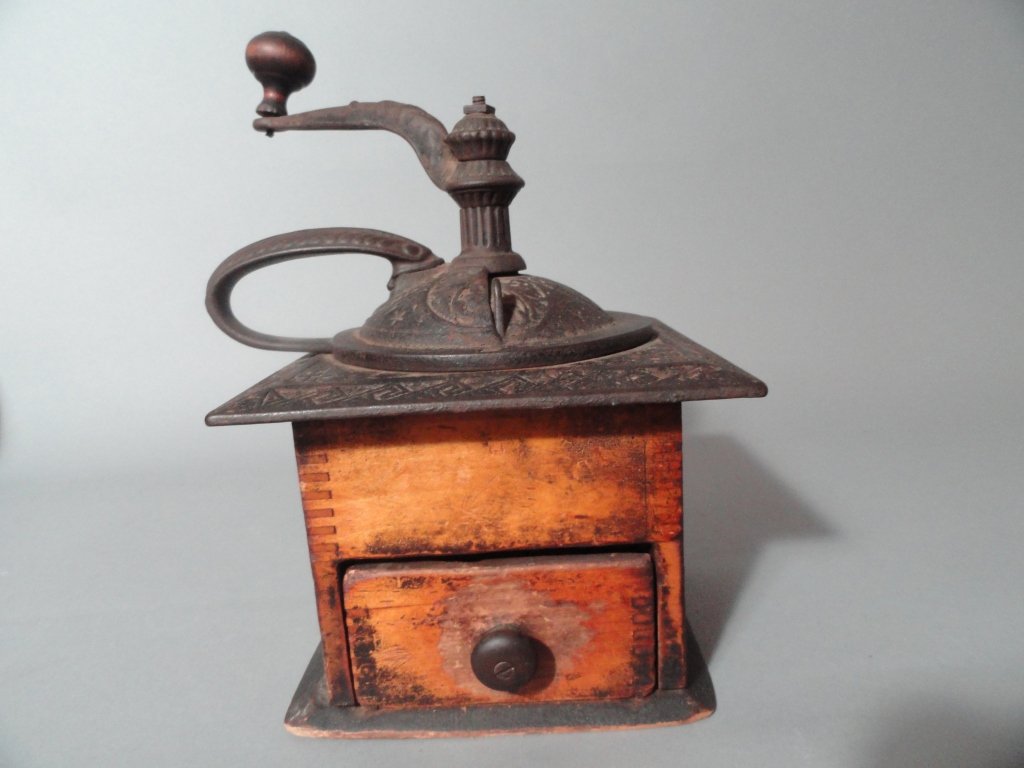 Antique Coffee Mill: Antique Coffee Mill Decorative stamping on top, Handle cast in top, Showing age and wear well.