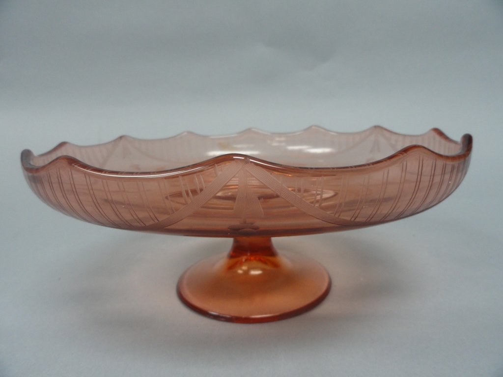 Pink Depression Glass Stand: Pink Depression Glass Stand, etched with flower and leaves Dimensions: 10in diameter, 4in tall