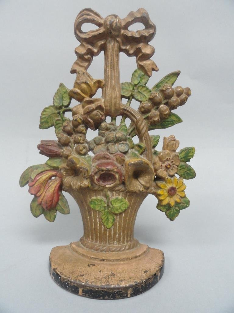 Hubley Lilies of the valley door stop: Hubley Lilies of the valley door stop. 10.5" tall and 7" wide. impressed stamp 139.