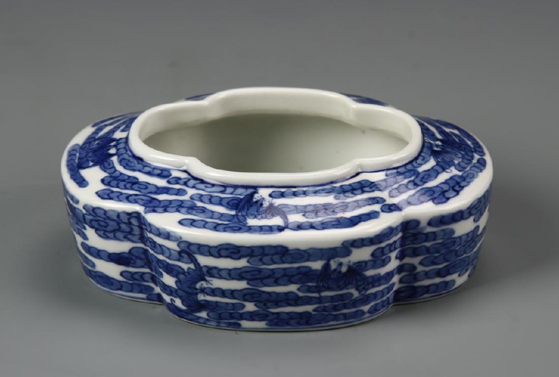 Chinese Blue and White Brush Washer: China, 19th C., blue and white brush washer, petal shaped body on flat base, dense blue decoration of clouds throughout exterior with Qianlong mark on plain base. Width 5 1/8 in., Height 1 3/4 in.