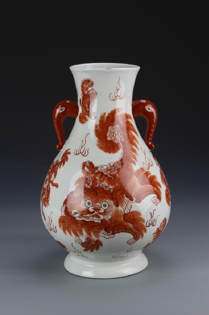 Chinese Famille Rose Vase: China, ROC Period, Famille Rose vase, with bulbous body, tapering to the thick neck, with two handles in the form of elephant heads, and red painted dragon motif, mark on base. Height 14 3/4 in.