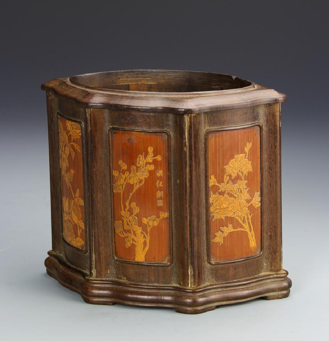 Chinese Bamboo Brush Pot: China, 19th C., multi-sided bamboo brush pot, with panels showing different types of flowers and calligraphy characters. Length 5 3/4 in., Height 7 in., Width 4 1/2 in.
