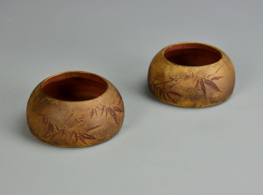 Pair of Chinese Yixing Brush Washers: China, ROC Period, pair of Yixing brush washers, with rounded bodies, tapered rims, in a brown hue, with carved motifs, mark on base. Width 3 in., Height 1 1/2 in.