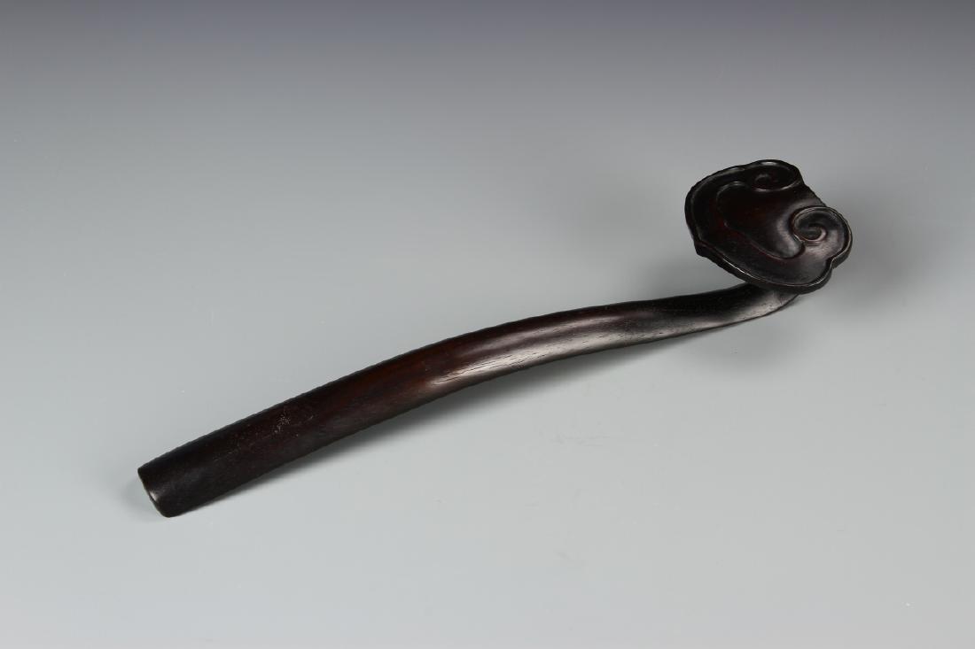 Chinese Hardwood Ruyi Scepter: China, 19th C., hardwood Ruyi scepter, dark wood coloring throughout with carved handle in the form of a single, large Ruyi mushroom. Length 11 7/8 in.