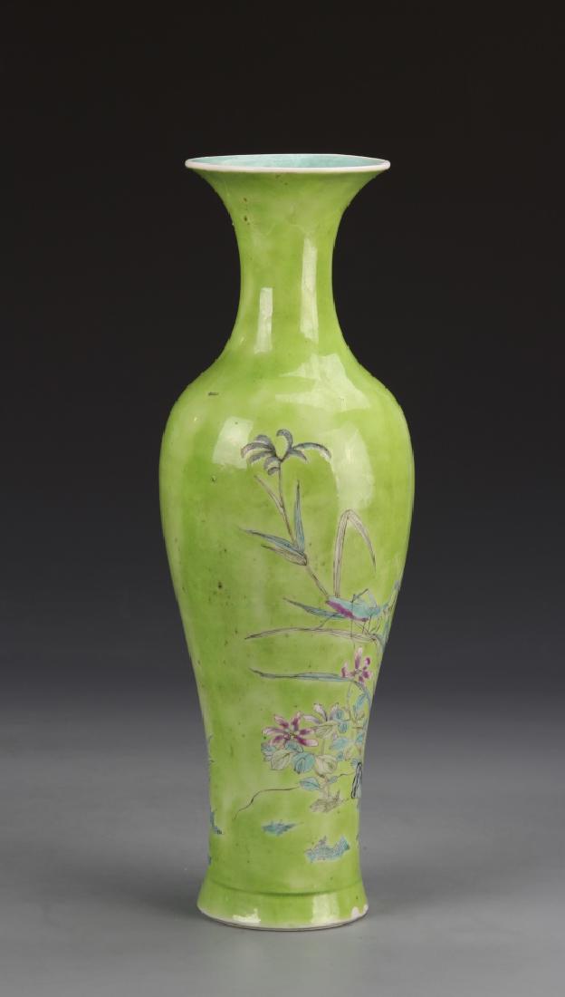 Chinese Famille Rose Vase: China, 19th C., Famille Rose vase, with a high shoulder sloping into a flared rim, flared base, and plant life motifs against a light green background, minor repairs and chips. Height 12 1/4 in.