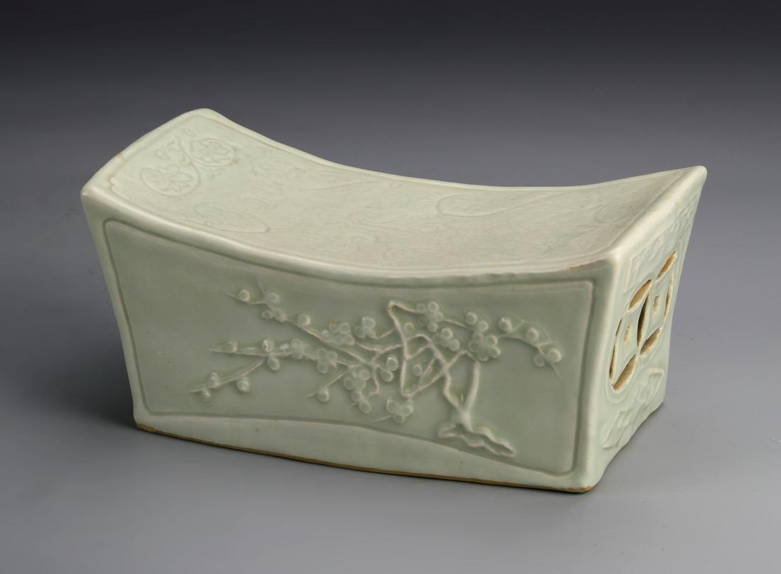 Chinese Antique Lungquan Ware Pillow: China, antique Lungquan ware pillow, in rectangular form, with curved top, featuring scrolling tree and floral motifs. Height 4 in., Length 8 1/2 in., Width 2 1/2 in.