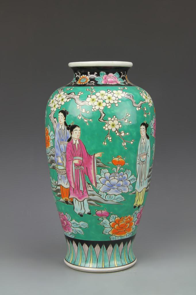 Chinese Famille Rose Vase: China, 19th C., Famille Rose vase, with a flared base, high shoulder, short neck and flared rim, lappet design around base, floral designs around the rim . Height 12 in.