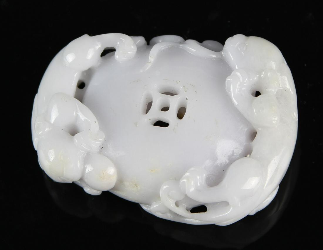 Chinese Jadeite Pendant: China, jadeite pendant, with two mythical animal figures, geometric cut out details, and hole on one side. Length 2 1/8 in.
