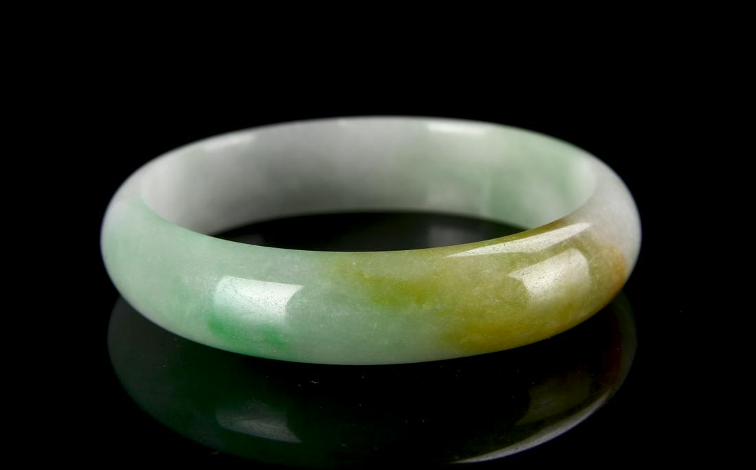 Chinese Jadeite Bangle: China, Jadeite bangle. diameter: 2 3/4 in.