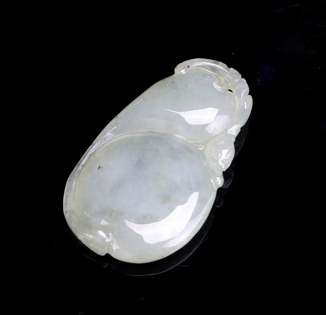 Chinese Jadeite Pendant: China, jadeite pendant, smoothly carved in two globular forms, with intricate designs along the edges. Height 1 3/4 in.