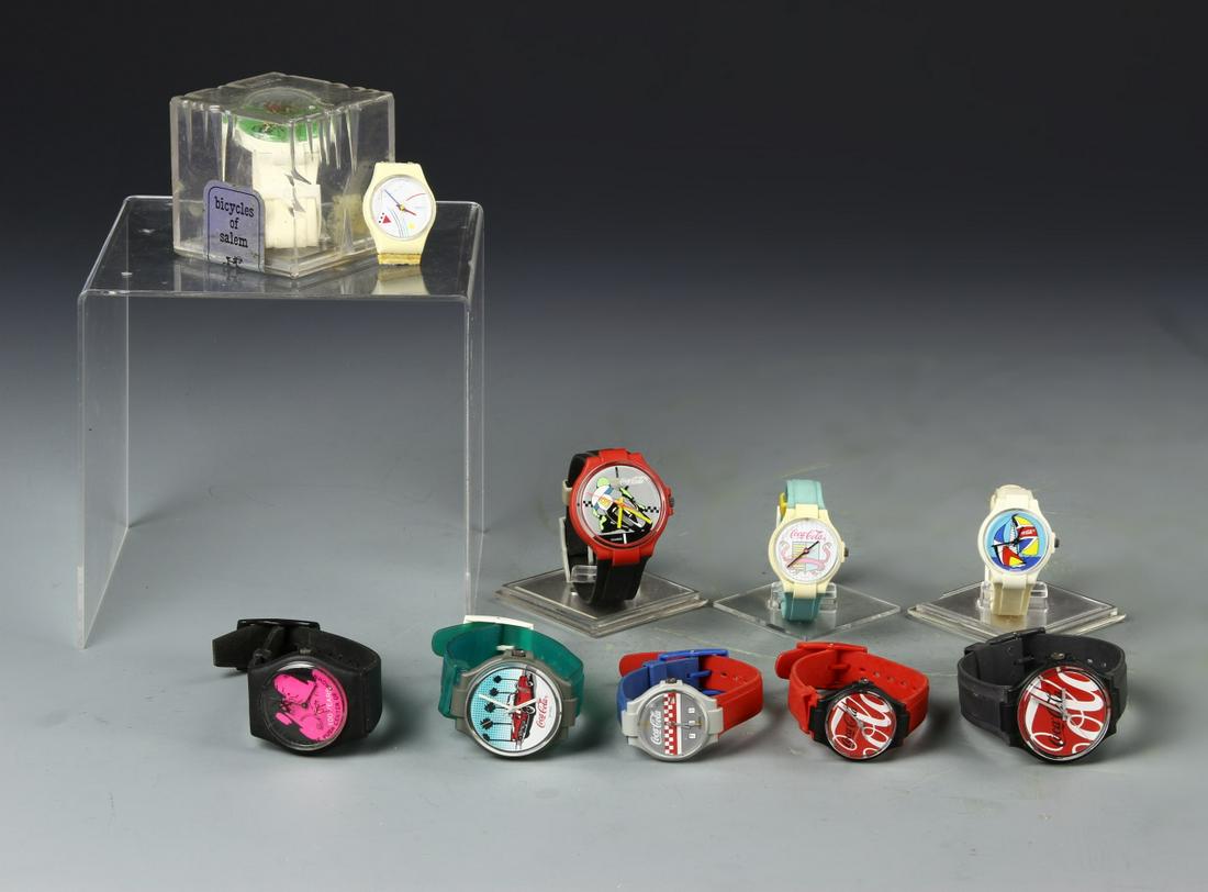 Ten Swatch Watches: Ten SWATCH watches in ask found condition. Width 3in.