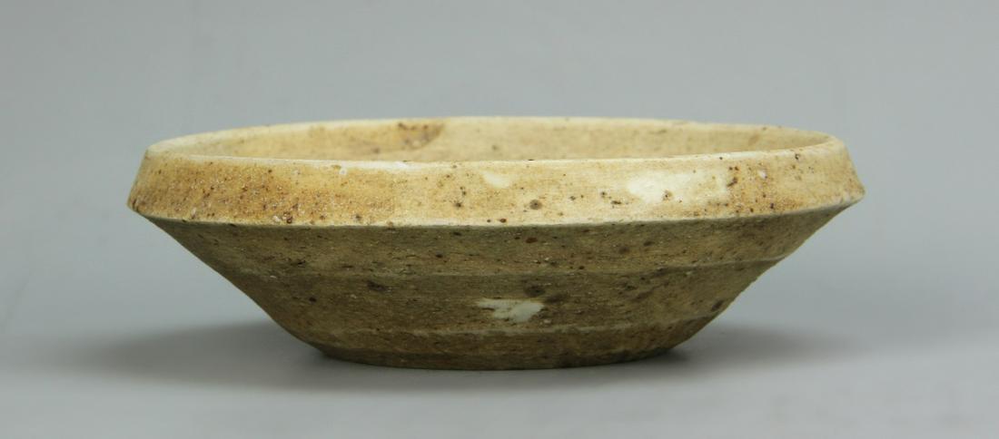 Chinese Antique Blue and White Brush Washer: China, antique blue and white brush washer, with unglazed exterior, interior glazed in a white ground and decorated with a single blue Chinese character. Diameter 4 in., Height 1 1/8 in.