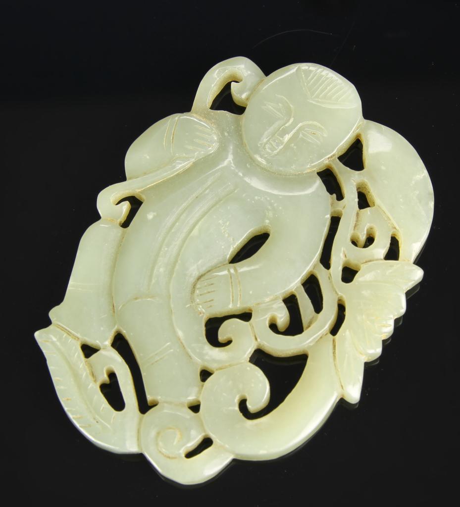 Chinese Carved Jade Figure: China, 19th C., carved jade figure, expertly carved jade figure with undefined lower half, in front of intricate auspicious symbols. Height 3 1/4 in.