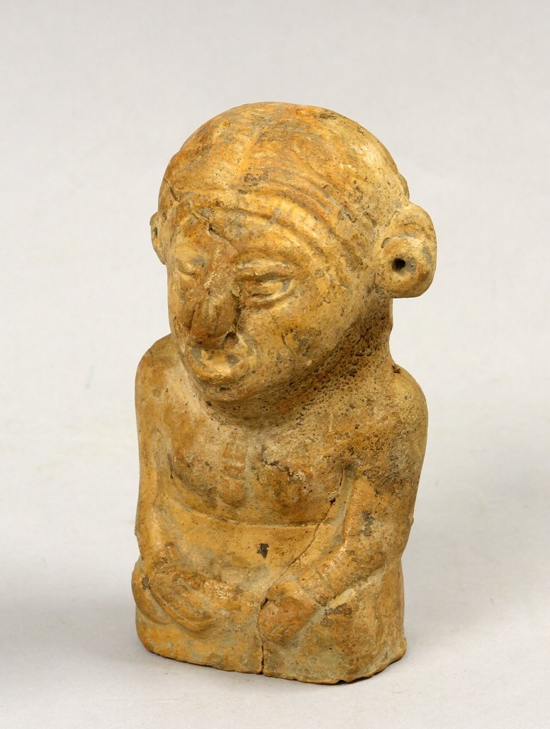Mayan Pre-Columbian Seated Figure: Mayan, Pre-Columbian, stone figure in a seated position, featuring carved arms, hands, and facial features. Height 4 in. Provenance: From a Seattle, Washington Collection. Provenance: From a Seattle, 