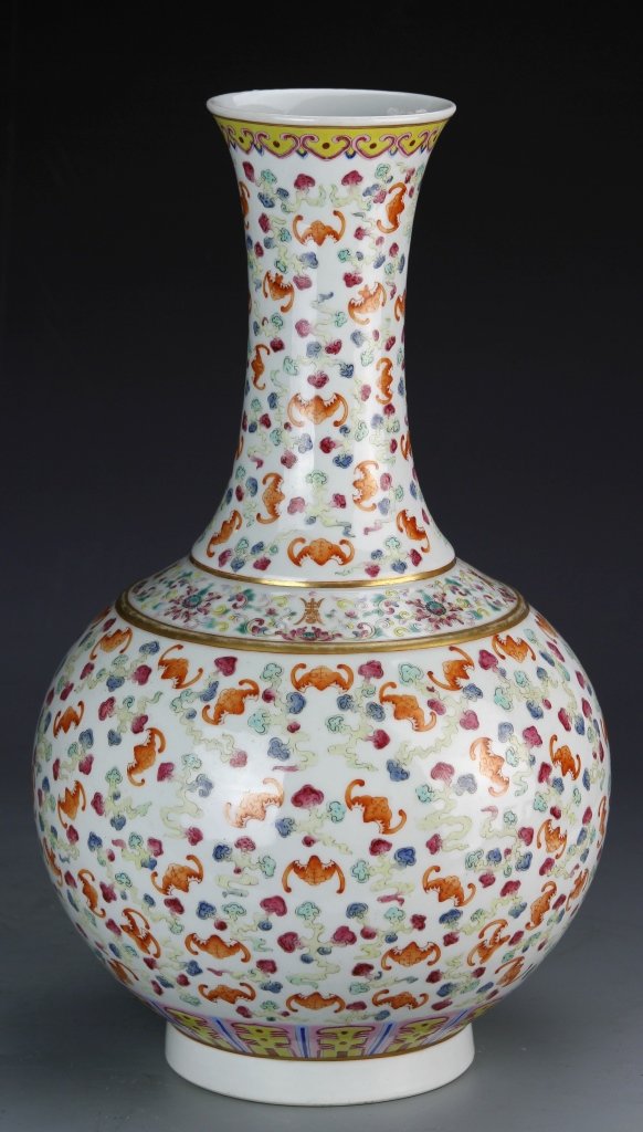 Chinese Famille Rose Vase: China, 19th C., Famille Rose vase, long neck with bulbous body on footed base, orange bats appear with a swirl design throughout, with patterned bands at the rim, neck and base, Guangxu mark on base. 