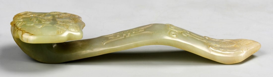 Chinese Jade Ruyi Scepter: China, ROC Period, jade Ruyi scepter, carved with stylized natural scenes and auspicious symbols Length 5 3/4 in.