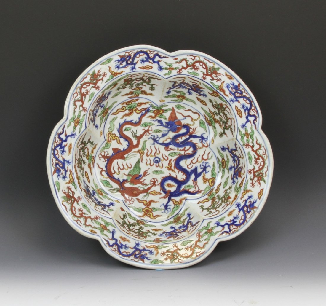 Chinese Wucai Basin: China, Wucai basin with vibrant serpentine dragons, flaming pearls and auspicious symbols, Ming Long Qing mark on base. Height 3 1/2 in., Width 15 3/4 in.