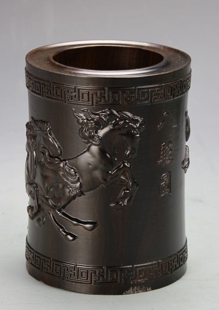 Chinese Carved Wood Brush Pot: China, carved wood brush pot, decorated with a raised keyfret pattern around the lip and base, with wild horse and calligraphy pattern on the sides. Height 5 3/8 in. Width 4 3/8 in.
