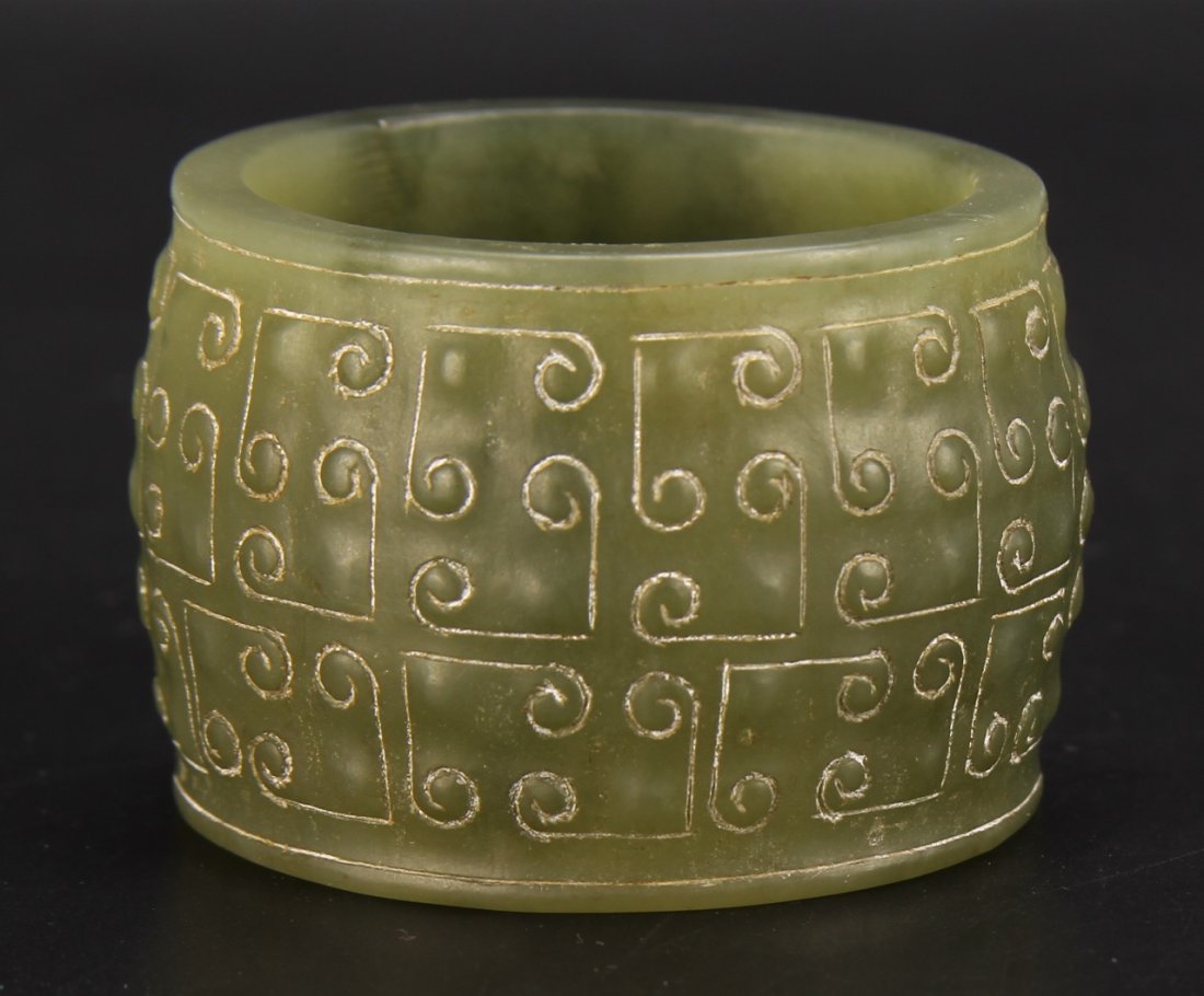 Chinese Carved Jade Miniature Cong: China, carved jade miniature cong, geometric details around small raised mounds covering the base. Height 1 1/4 in., Width 1 3/4 in.