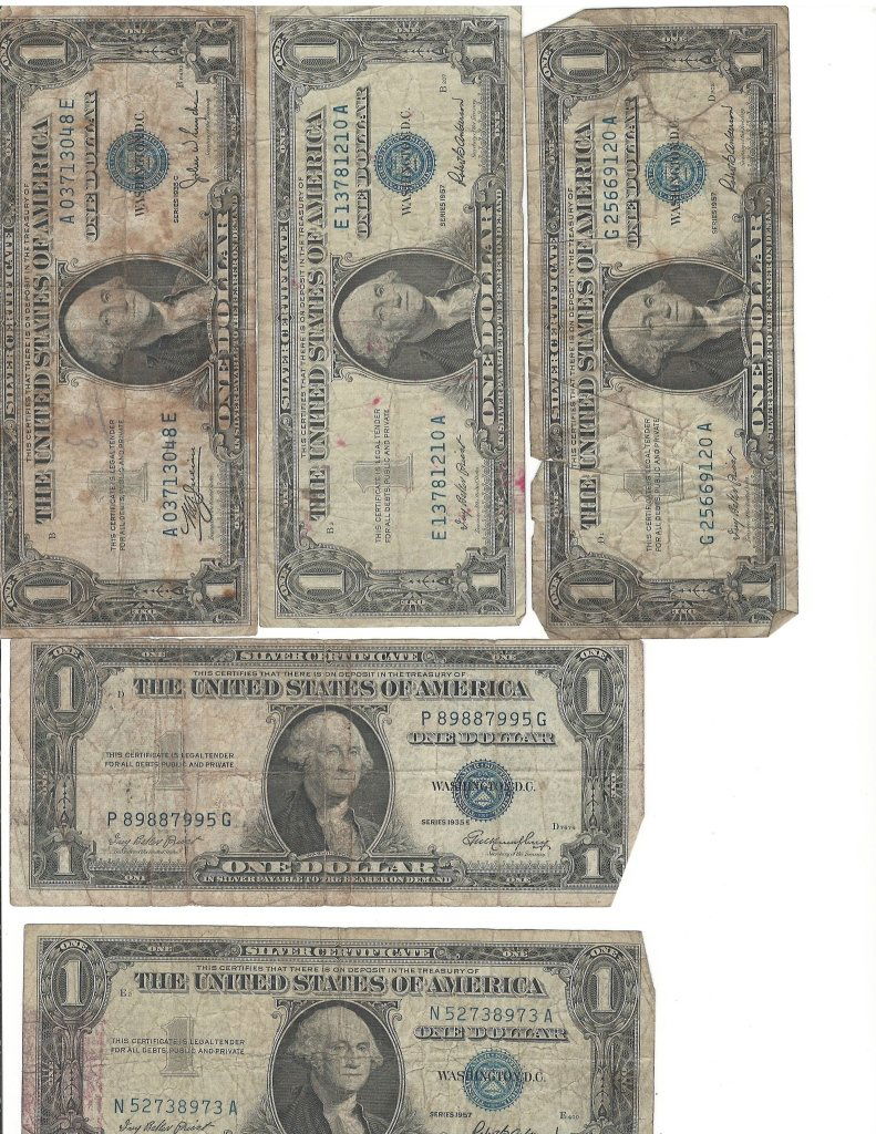 Nine Bank Notes: 5 One dollar bills, two 100, two 1,000.