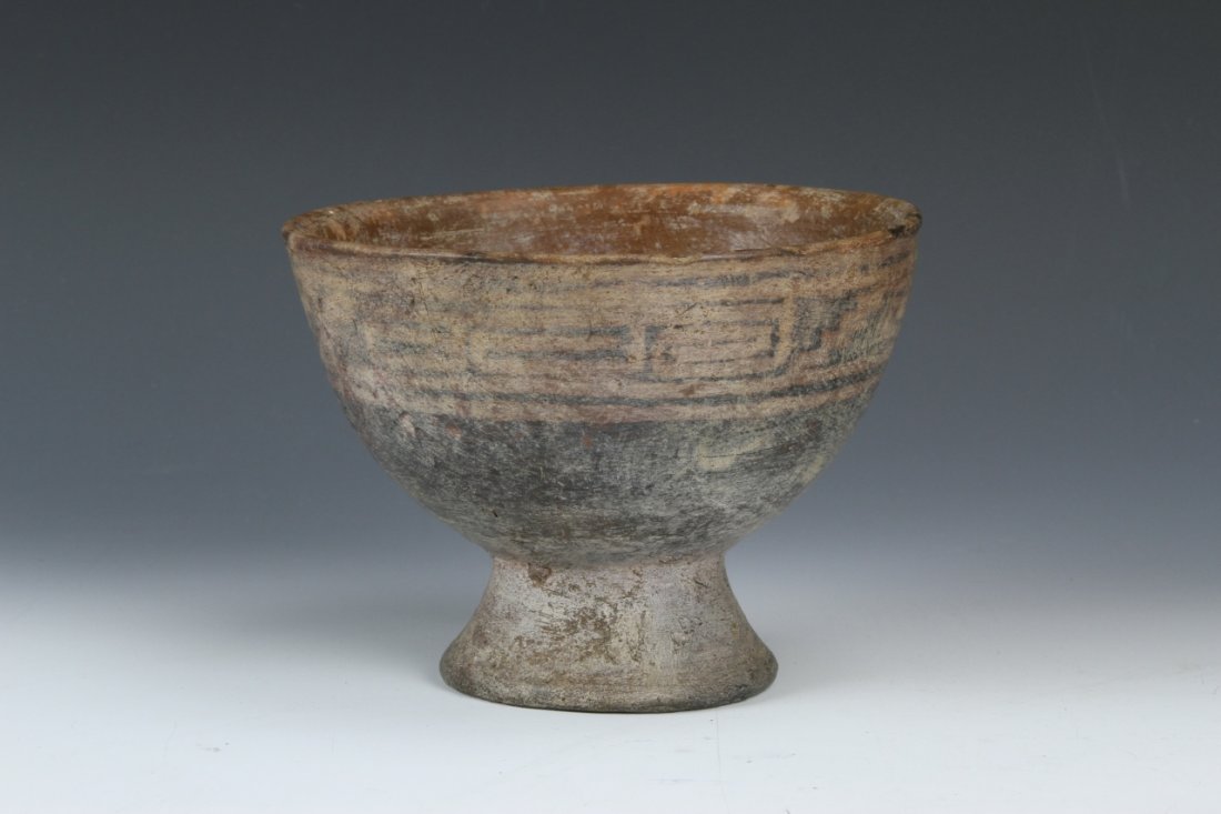 Pre-Columbian Footed Bowl: Pre-Columbian, footed bowl in an earthenware, raised and decorated at the rim with geometric patterns. Height 4 in. Width 5 1/2 in.