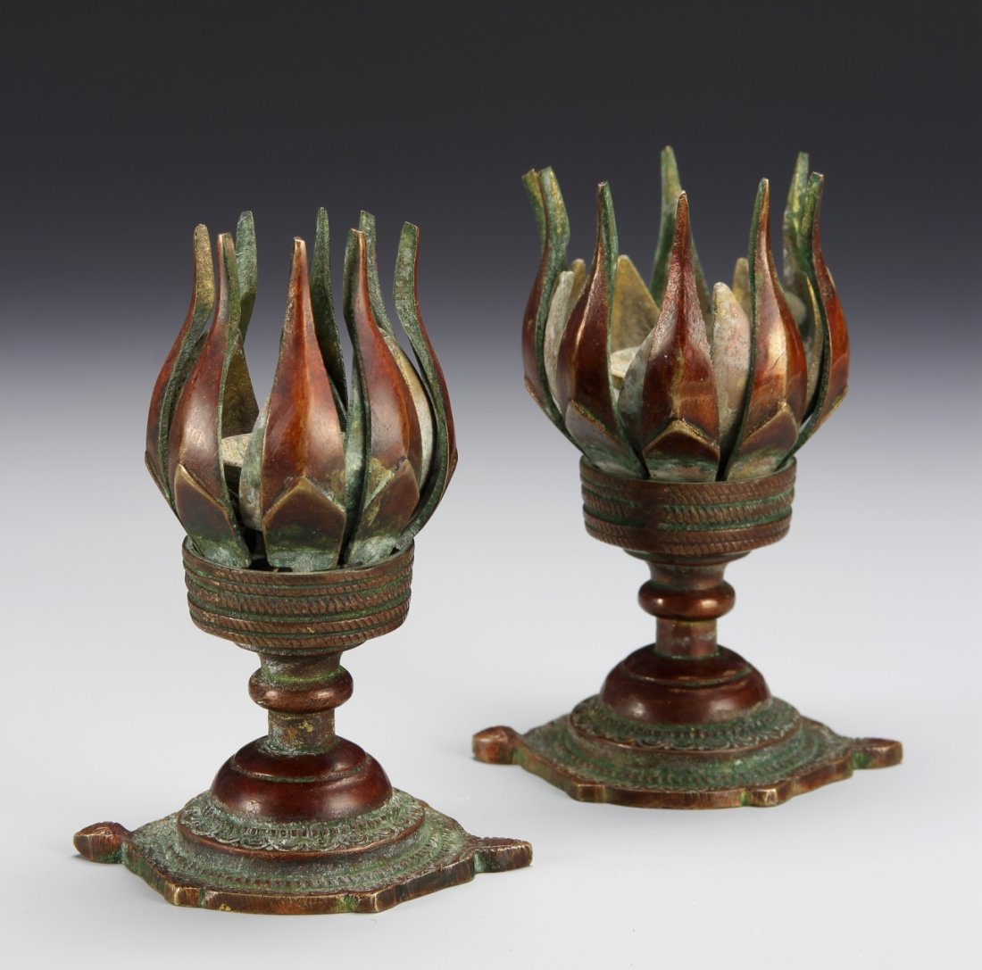 Pair of Chinese Lotus Candle Sticks: China, 19th C., a pair of lotus candle sticks, formed like petals beginning to open, sitting on a stem like base, decorated in a Ruyi design with a weave pattern at the neck. Height 4 1/2 in._x000D_