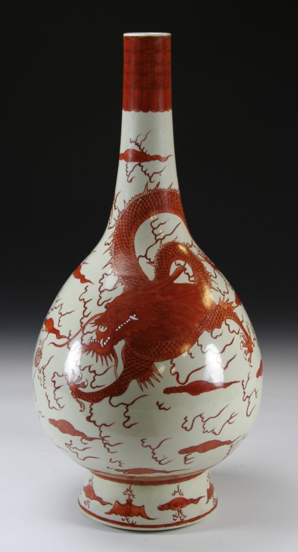 Chinese Copper Red Dragon Vase: China, 18/19th C., vase in a bottle form with a long neck, decorated with a flying dragon amidst clouds, Kangxi mark on base. Height 18 1/4 in.
