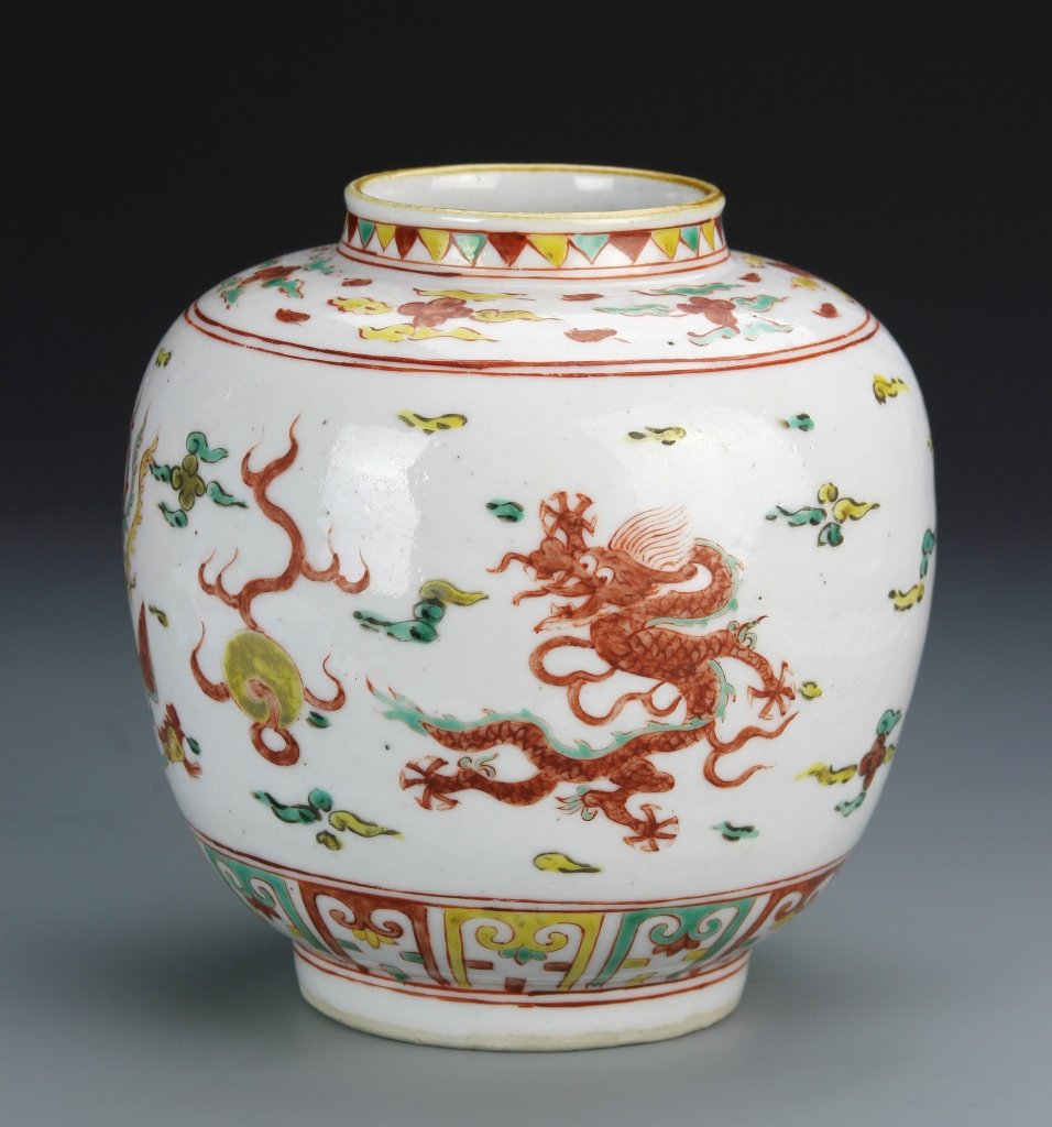 Chinese Ming Period Wucai Jar: China, Ming Period, Wucai jar decorated with colorful auspicious symbols and a five-clawed serpentine dragon and flaming pearls. Height 6 3/4 in.