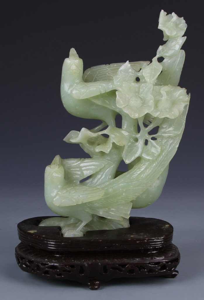 Chinese Jade Bird: China, jade bird with base, each bird looks upward, with floral elements curving around birds, with carved wooden base, minor damage. Height 7 1/2 in.