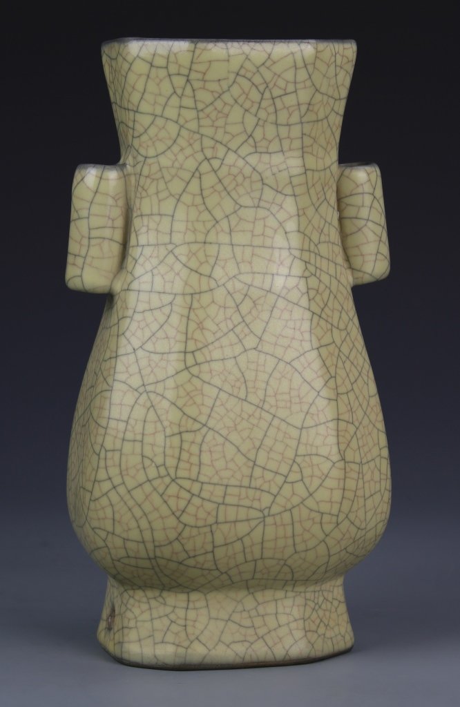Chinese Ge Ware Vase with Two Handles: China, Ge Ware vase with two cylindrical ears, a bulbous body tapering to a slightly flared lip, platform base, and crackle glaze. Height 9 in.