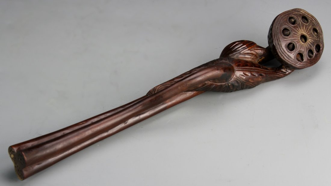 Chinese Boxwood Ruyi Scepter: China, intricately carved boxwood Ruyi scepter, featuring naturalistic decorations of a lotus seed pod and stem . Length 14 in.