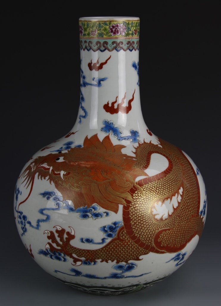 Chinese Famille Rose Dragon Vase: China, Famille Rose dragon vase, bulbous body with long narrow neck, floral pattern around the rim, painted five clawed red dragon encircling the body, mark on base. Height 14 1/2 in.