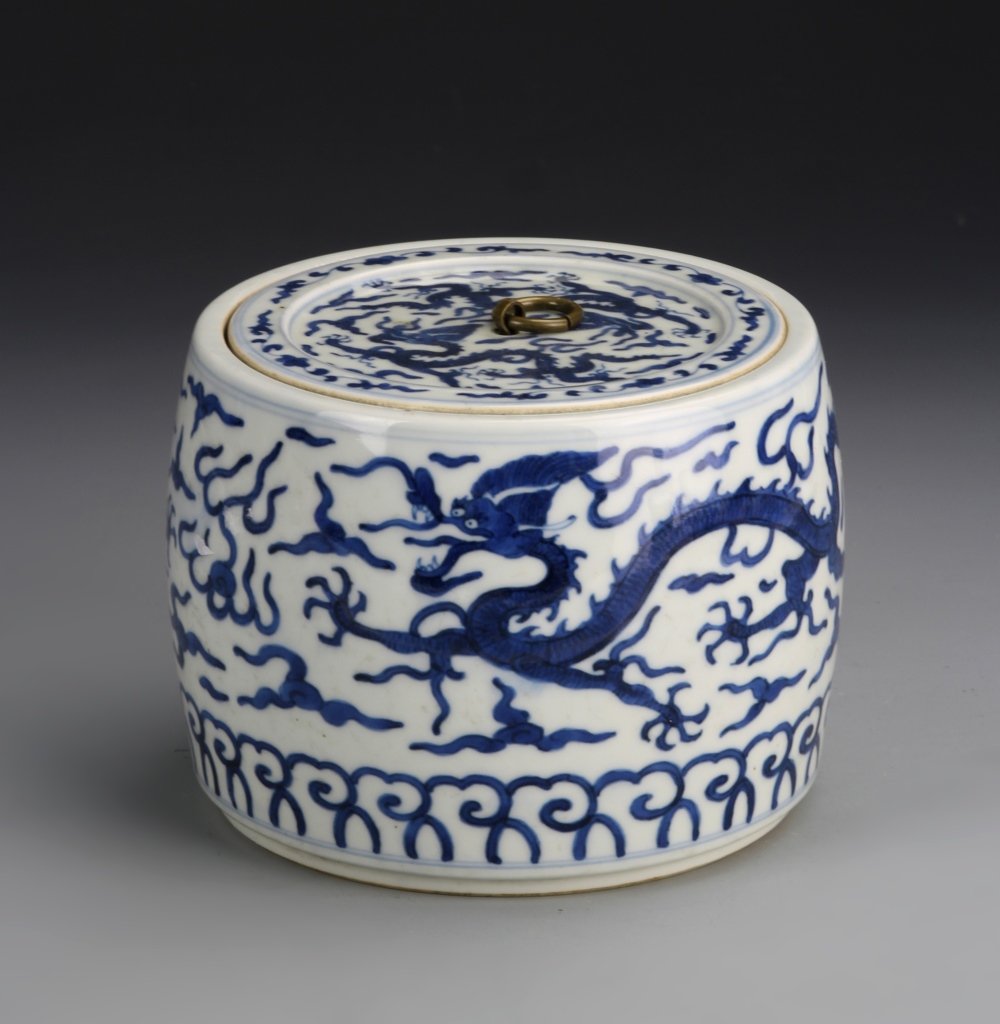 Chinese Blue and White Glazed Jar: China, 19th C., blue and white glazed jar, cylindrical in form, thin top cover, five-clawed dragon design encircling the body, mark on base. Height 15 in.