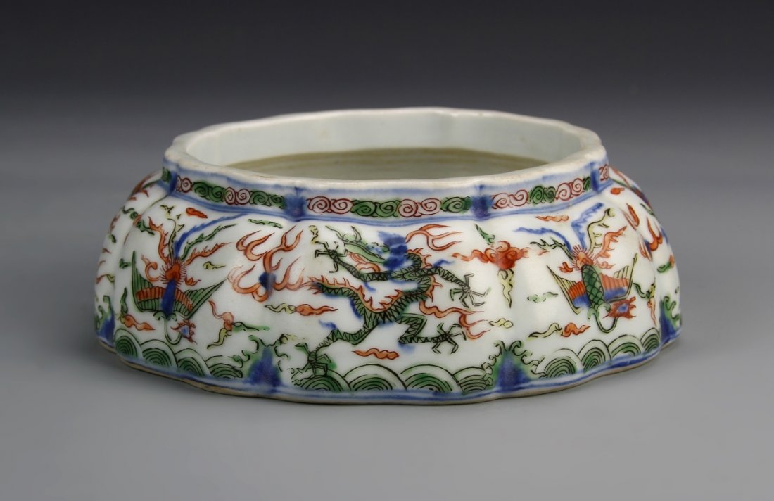 Chinese Antique Wucai Brush Washer: China, antique Wucai brush washer, in circular form, with scalloped body and rim, and colorful mythical creature motifs, Jiajing mark. Width 6 3/4 in.