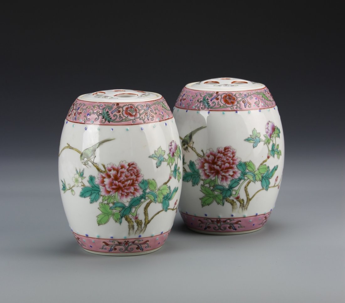 Chinese Pair of Famille Rose Jars: China, 20th C., a pair of Famille Rose jars, with bands of pink decoration around the shoulder and base, and bird and flower motifs across the body. Height 6 in.