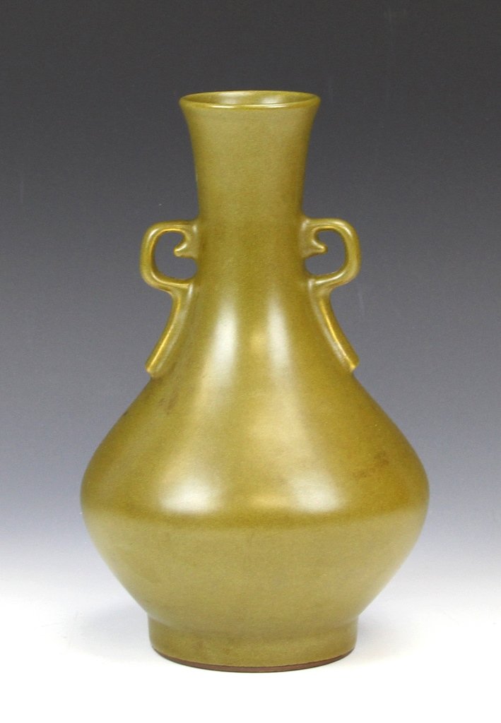 Chinese Glazed Vase: China, 19th C., glazed vase in matte olive green color, with two decorative geometric ears, bulbous body, and smooth surface, mark on base. Height 9 in.