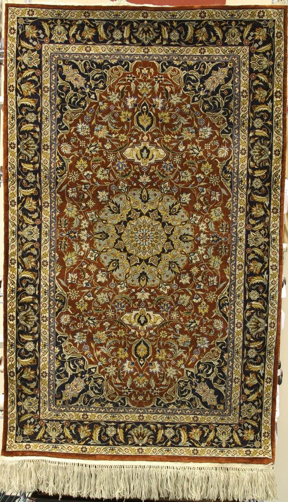 Antique Chinese Silk Carpet: China, silk carpet with densely patterned floral designs and fringed edges, in hues of blue, red, and yellow. Width 34 in., Length 56 in.